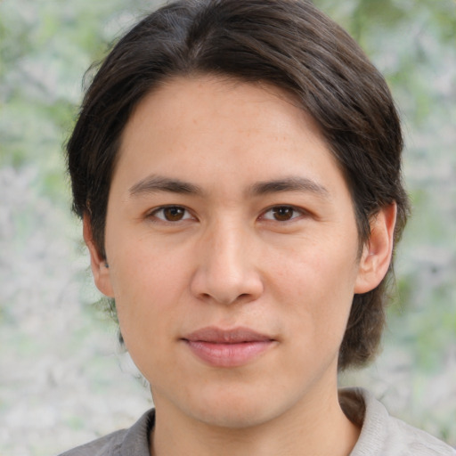 Joyful white young-adult male with medium  brown hair and brown eyes