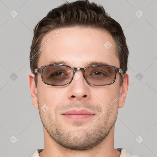 Joyful white young-adult male with short  brown hair and grey eyes