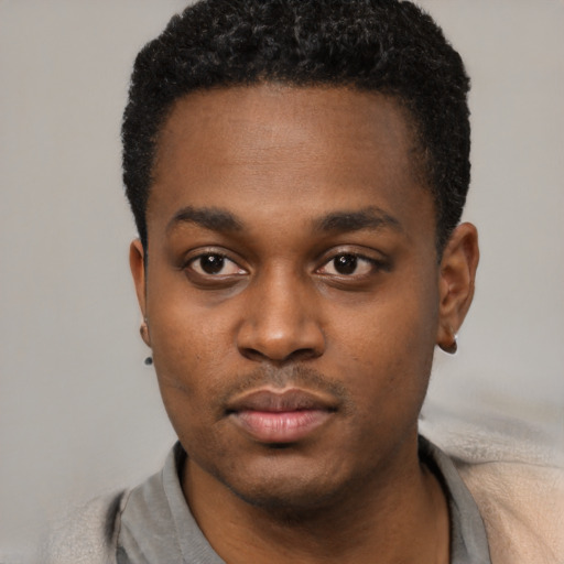 Neutral black young-adult male with short  black hair and brown eyes