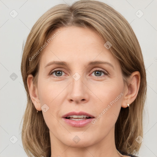 Joyful white adult female with medium  brown hair and grey eyes