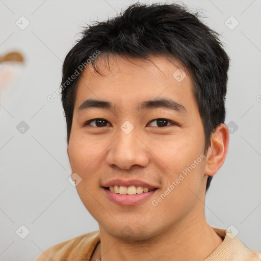 Joyful asian young-adult male with short  brown hair and brown eyes