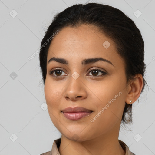 Joyful latino young-adult female with medium  black hair and brown eyes