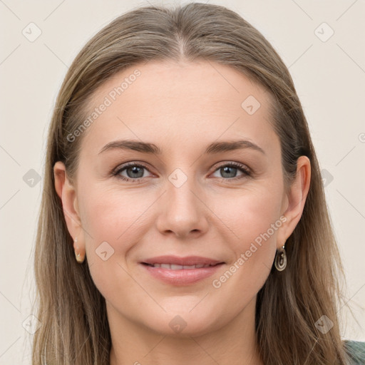 Joyful white young-adult female with long  brown hair and grey eyes