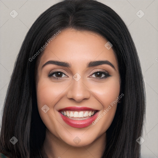 Joyful latino young-adult female with long  black hair and brown eyes