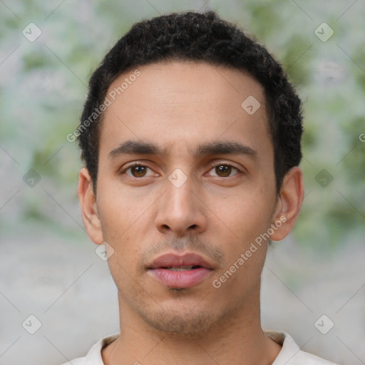 Neutral latino young-adult male with short  black hair and brown eyes