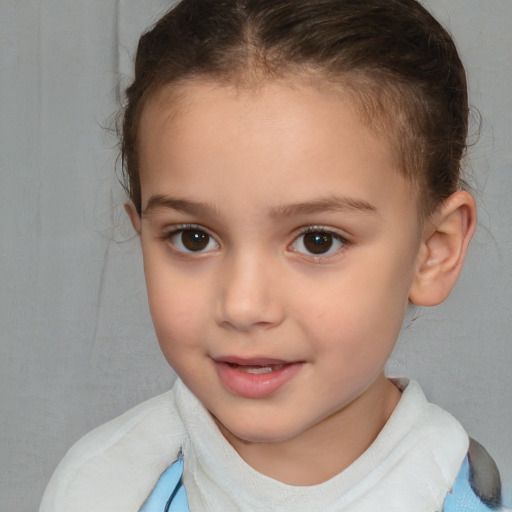 Joyful white child female with short  brown hair and brown eyes