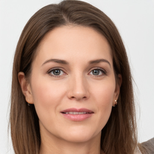 Joyful white young-adult female with long  brown hair and grey eyes