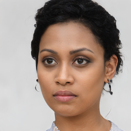 Neutral latino young-adult female with long  black hair and brown eyes