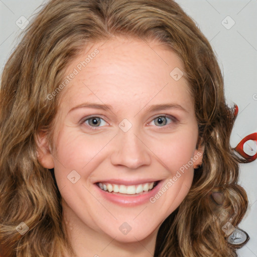 Joyful white young-adult female with long  brown hair and blue eyes