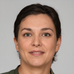 Joyful white adult female with short  brown hair and grey eyes