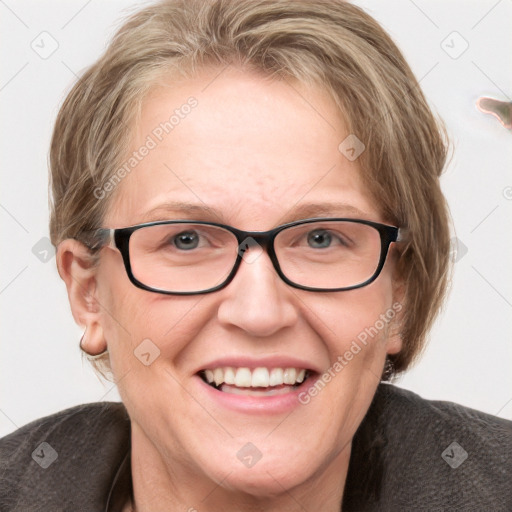 Joyful white adult female with medium  brown hair and blue eyes