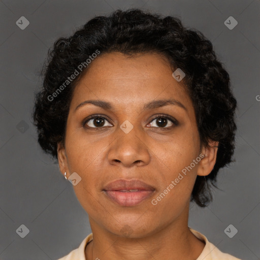 Joyful black adult female with short  brown hair and brown eyes