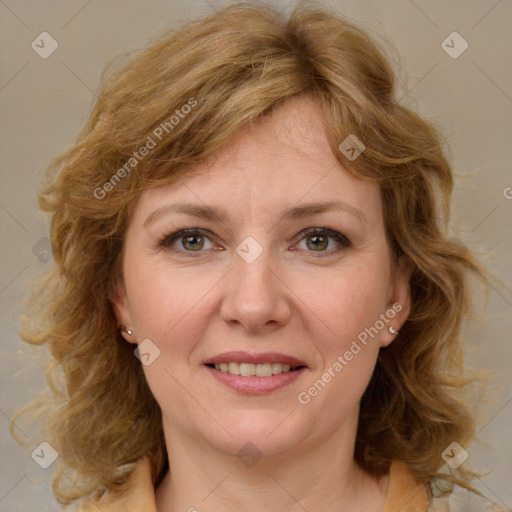 Joyful white adult female with medium  brown hair and blue eyes