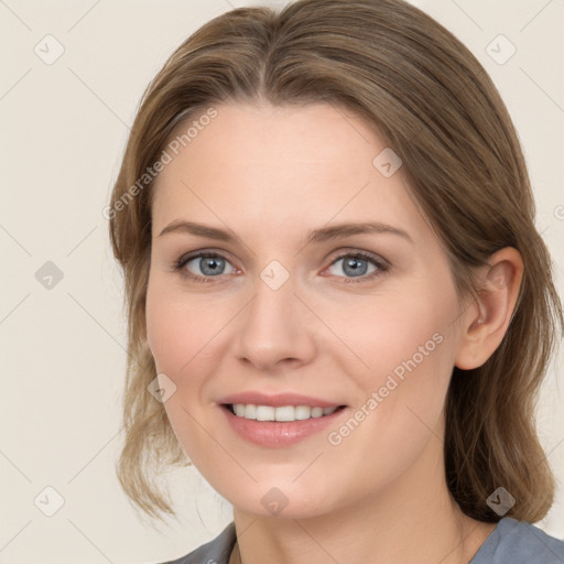 Joyful white young-adult female with medium  brown hair and blue eyes