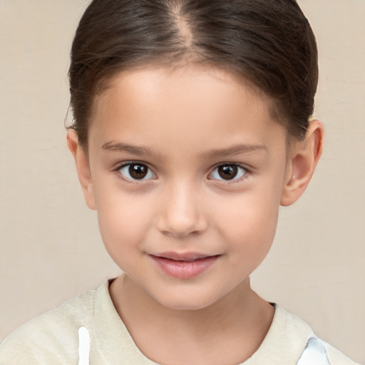 Joyful white child female with short  brown hair and brown eyes