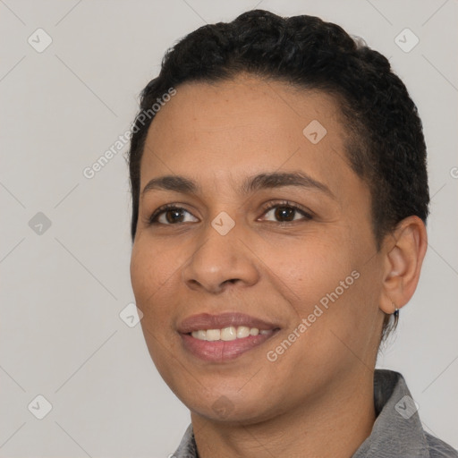 Joyful latino young-adult female with short  black hair and brown eyes