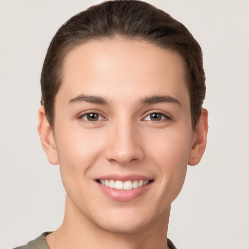 Joyful white young-adult female with short  brown hair and brown eyes