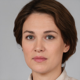 Neutral white young-adult female with medium  brown hair and brown eyes