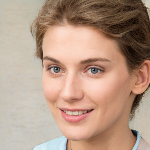 Joyful white young-adult female with medium  brown hair and green eyes