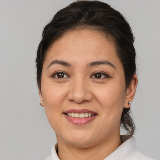 Joyful asian young-adult female with medium  brown hair and brown eyes