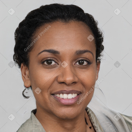 Joyful black young-adult female with short  brown hair and brown eyes