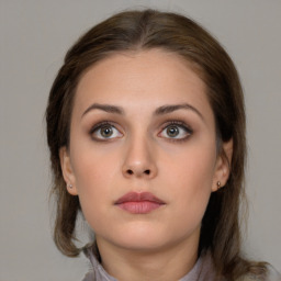 Neutral white young-adult female with medium  brown hair and brown eyes