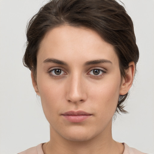 Neutral white young-adult female with short  brown hair and brown eyes