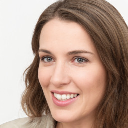 Joyful white young-adult female with medium  brown hair and green eyes