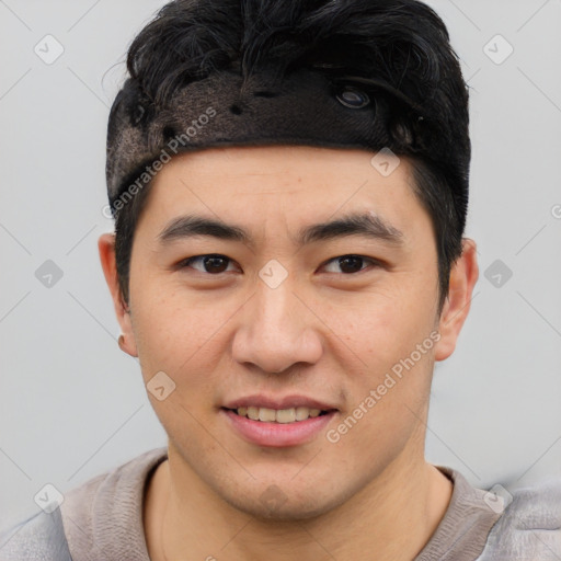 Joyful asian young-adult male with short  black hair and brown eyes