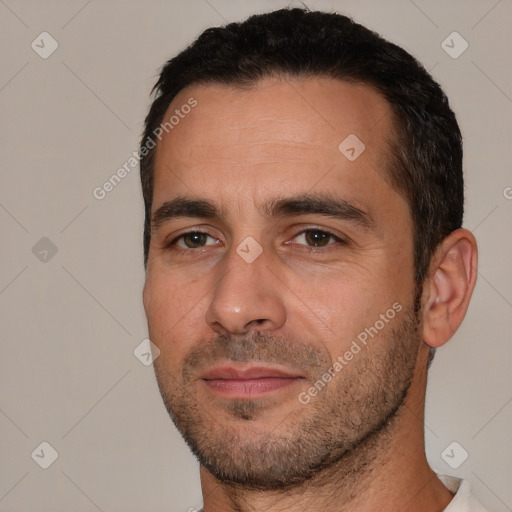 Joyful white adult male with short  brown hair and brown eyes