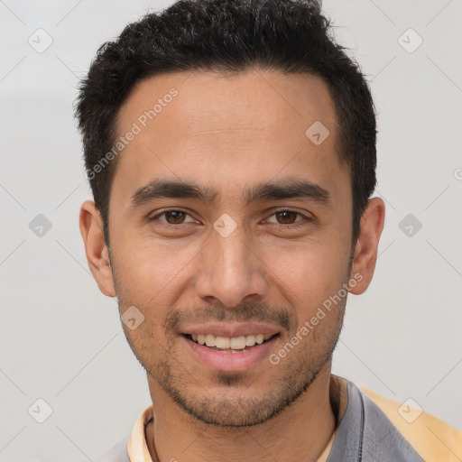 Joyful white young-adult male with short  black hair and brown eyes