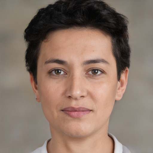 Joyful white adult female with short  brown hair and brown eyes