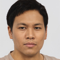 Neutral asian young-adult male with short  brown hair and brown eyes