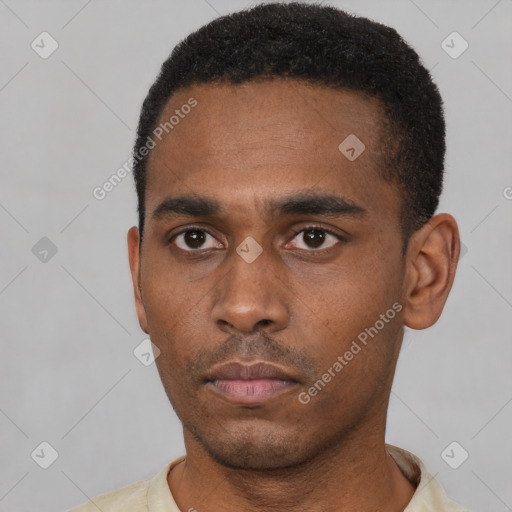 Neutral latino young-adult male with short  black hair and brown eyes