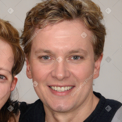 Joyful white adult female with medium  brown hair and blue eyes