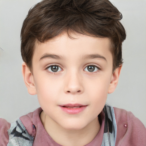 Joyful white child male with short  brown hair and grey eyes