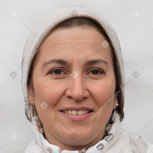 Joyful white adult female with short  brown hair and brown eyes