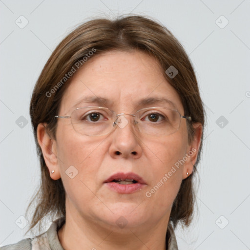 Joyful white adult female with medium  brown hair and grey eyes