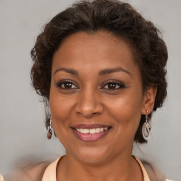 Joyful white adult female with short  brown hair and brown eyes