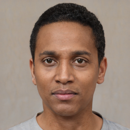 Neutral black young-adult male with short  black hair and brown eyes