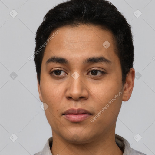 Neutral latino young-adult male with short  black hair and brown eyes