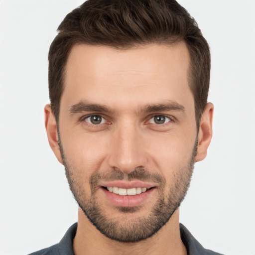 Joyful white young-adult male with short  brown hair and brown eyes