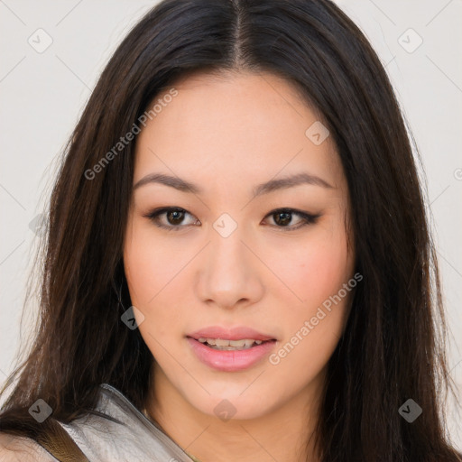 Joyful asian young-adult female with long  brown hair and brown eyes