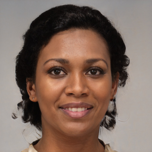 Joyful black young-adult female with medium  brown hair and brown eyes