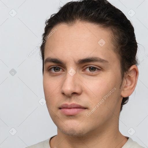 Neutral white young-adult male with short  brown hair and brown eyes