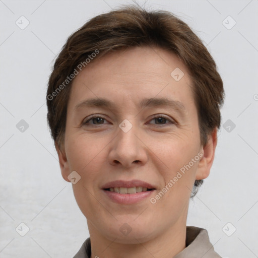 Joyful white adult female with short  brown hair and grey eyes