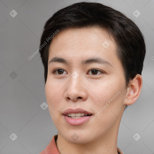 Joyful asian young-adult male with short  brown hair and brown eyes