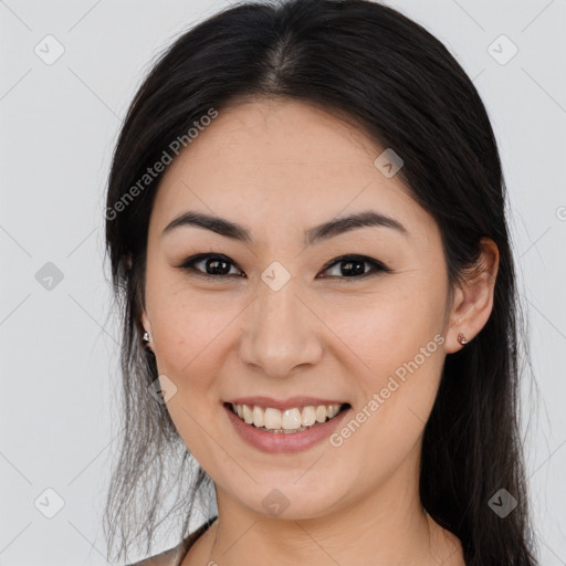 Joyful white young-adult female with long  brown hair and brown eyes