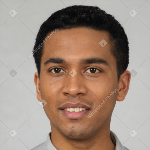 Joyful latino young-adult male with short  black hair and brown eyes