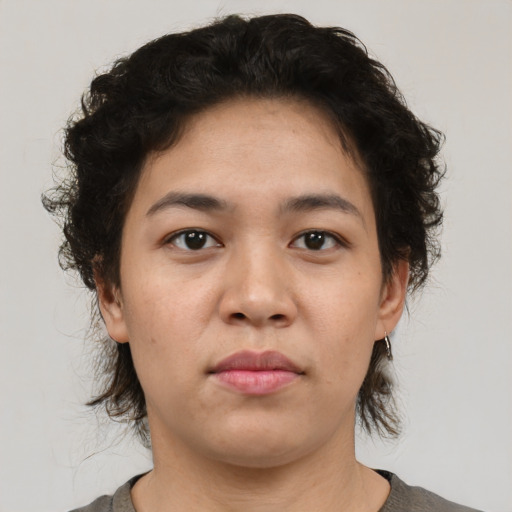 Neutral latino young-adult female with medium  brown hair and brown eyes
